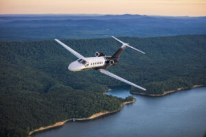 Cessna Citation CJ3 private jet flying in the air.