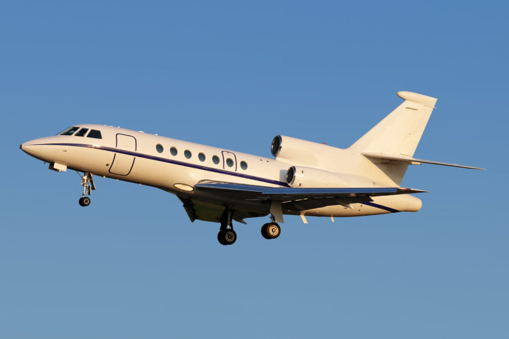 Dassault Falcon 2000EX private jet at takeoff