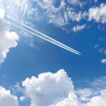 Private jet in flight representing charter safety due diligence