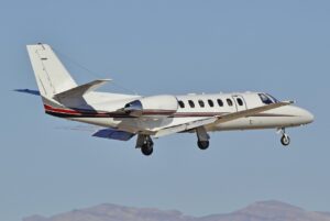 Cessna Citation V private jet in flight over Las Vegas.