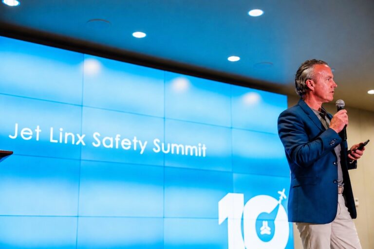 Jamie Walker delivers closing remarks at the Jet Linx Safety Summit in 2026.