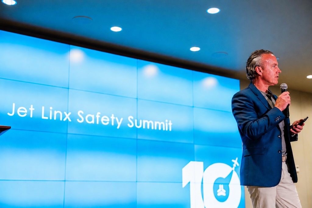 Jamie Walker delivers closing remarks at the Jet Linx Safety Summit in 2026.
